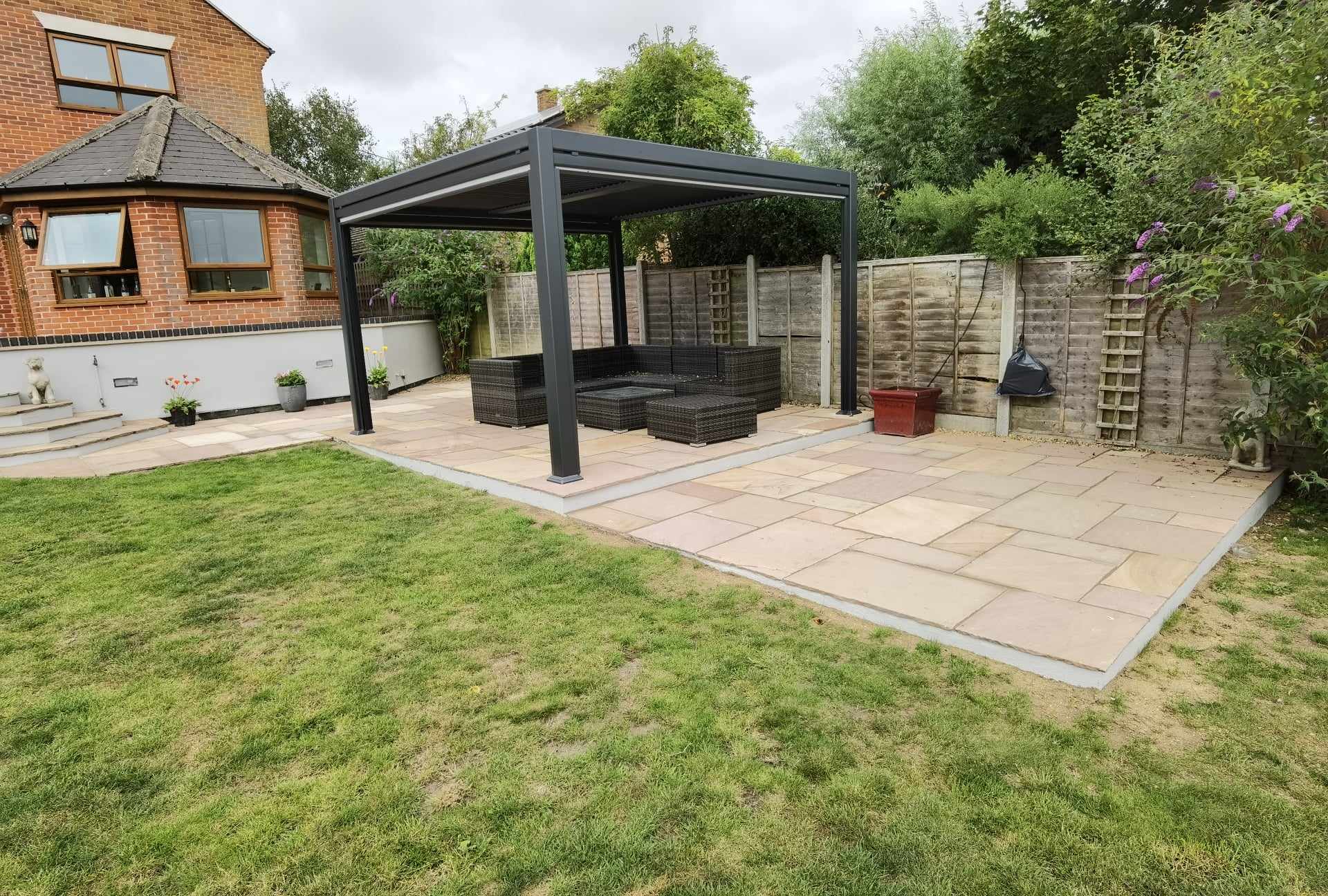 Completed garden transformation Suffolk — Finished garden transformation with new patio, pergola, and landscaping